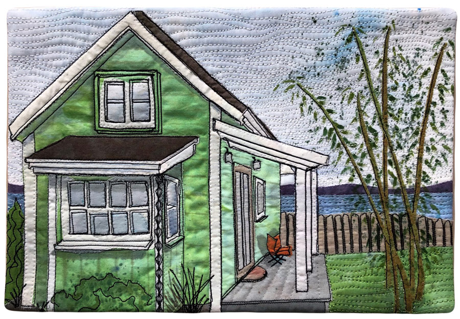 Thread sketched and painted art quilt of cottage in Langley, WA