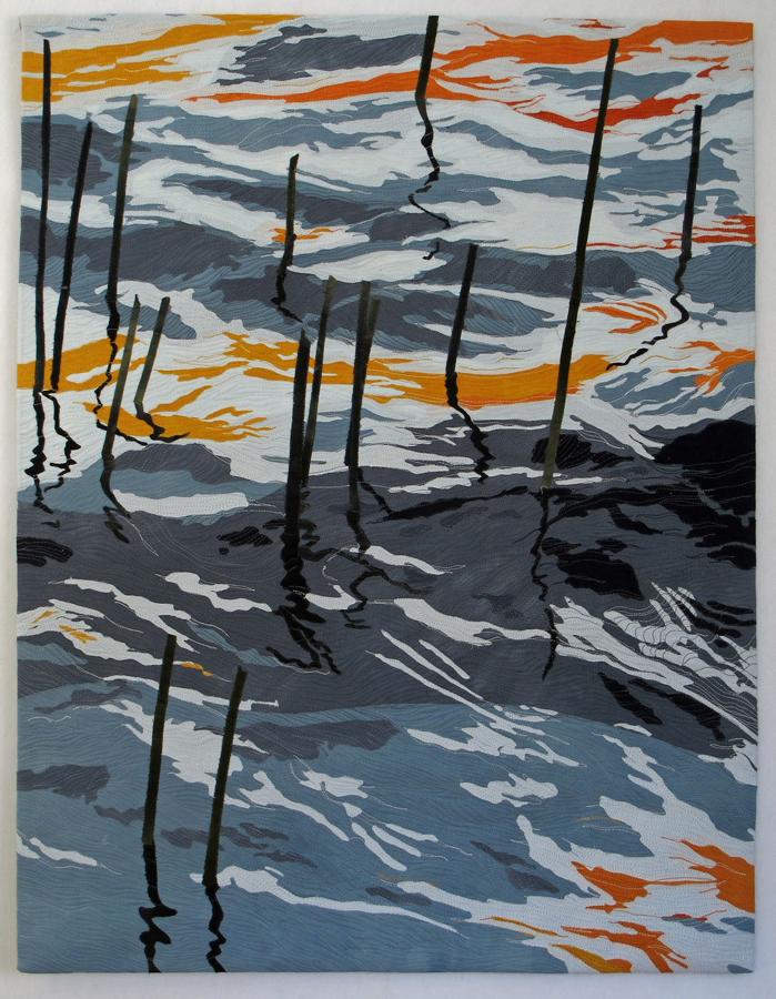 : Collaged  art quilt of autumn pond reflections in Maine