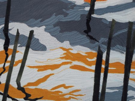 : Collaged  art quilt of autumn pond reflections in Maine